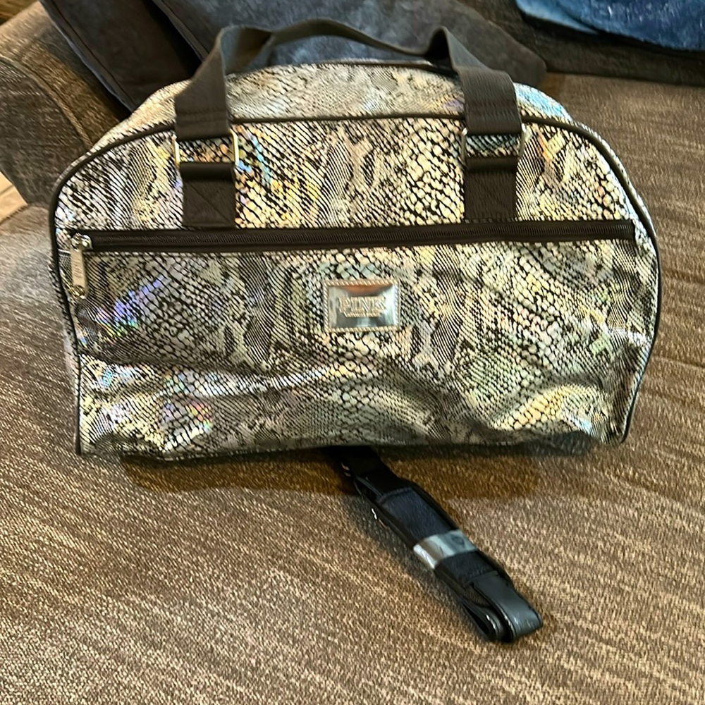 Pink Victoria’s Secret carry on bag